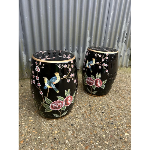 176 - A pair of Oriental ceramic garden seats decorated with bird patterns