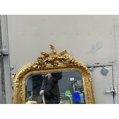 179 - A large ornate gold gilt wall mirror 85x 160