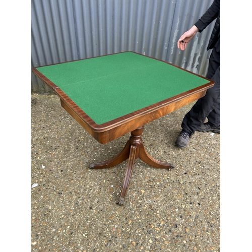 183 - A reproduction mahogany card table