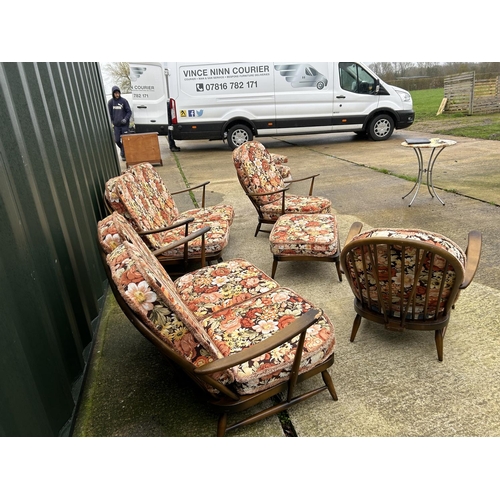 221 - An Ercol dark elm five piece lounge suite consisting two sofas, one chair and a footstool