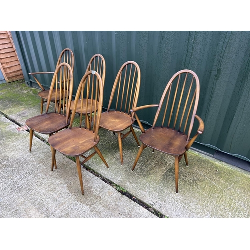 224 - A set of six Ercol dark elm stick back chairs