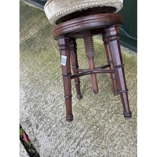 229 - A Regency rosewood adjustable piano stool