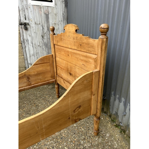 23 - A french style pine single sleigh bed, boltless fixing with all slats