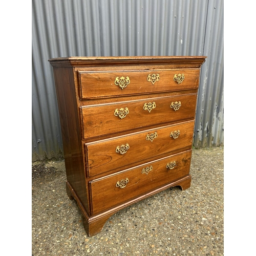 24 - A Georgian style oak chest of four drawers 88x47x100