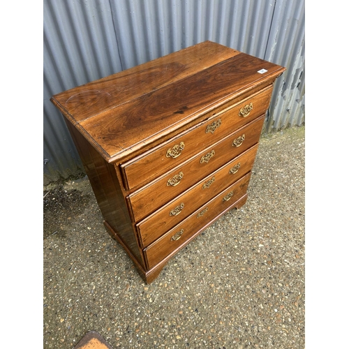 24 - A Georgian style oak chest of four drawers 88x47x100