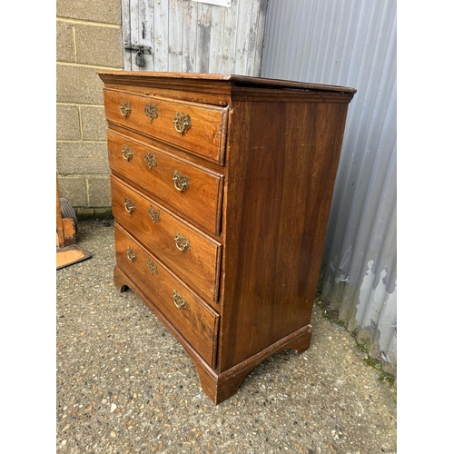 24 - A Georgian style oak chest of four drawers 88x47x100