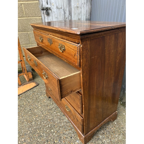 24 - A Georgian style oak chest of four drawers 88x47x100