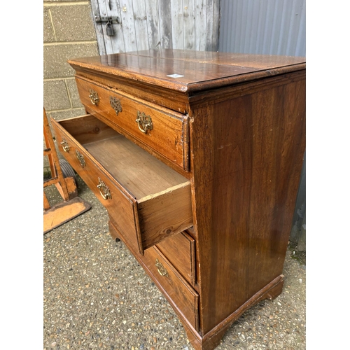 24 - A Georgian style oak chest of four drawers 88x47x100