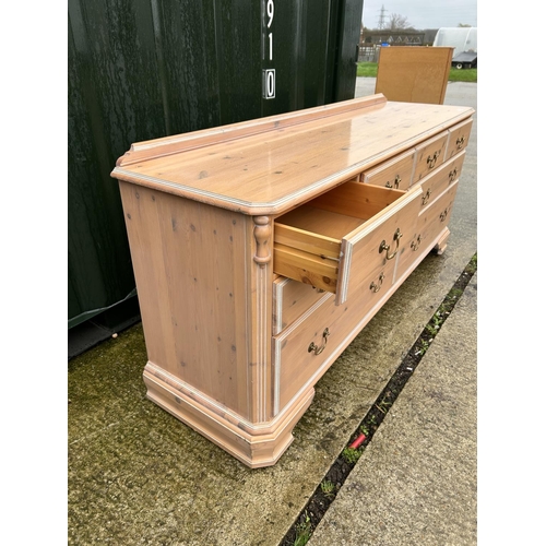 252 - A pine lowboy chest of 8 drawers 170x46x72