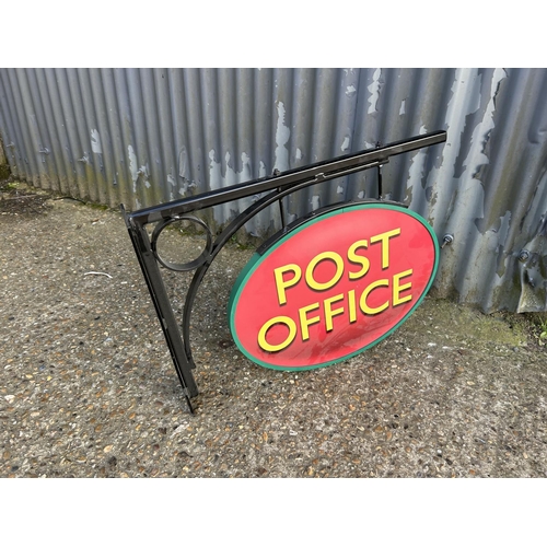 279 - A double sided post office sign on iron wall bracket 74x55