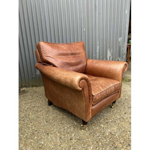 29 - A good quality tan brown leather club armchair by LAURA ASHLEY