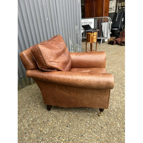 29 - A good quality tan brown leather club armchair by LAURA ASHLEY