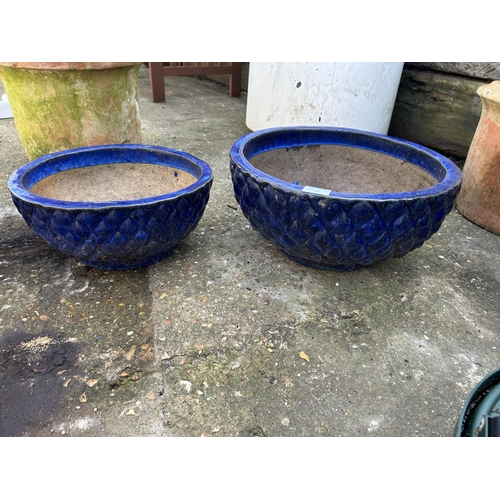 312 - A graduated set of three blue glazed pots