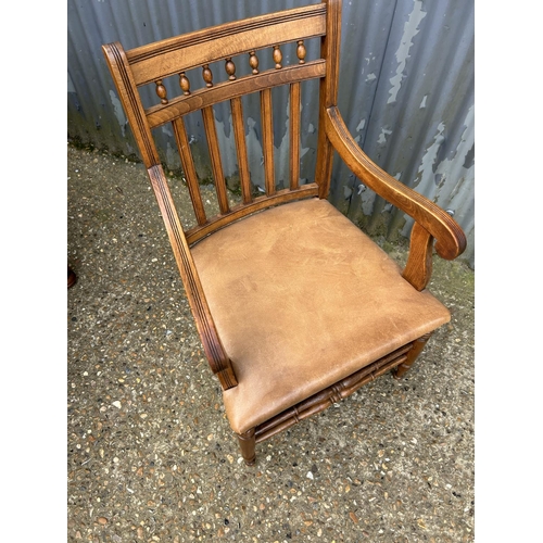 38 - A good quality mahogany desk chair with brown leather seat