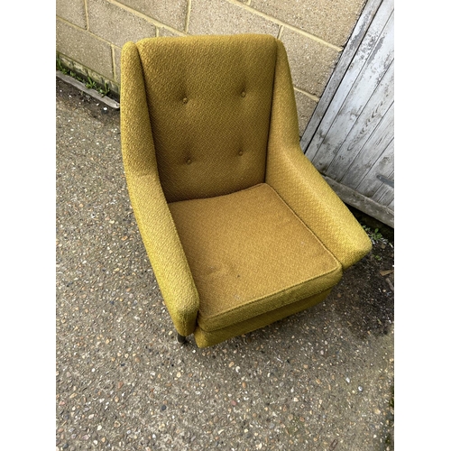 43 - A retro gold upholstered armchair