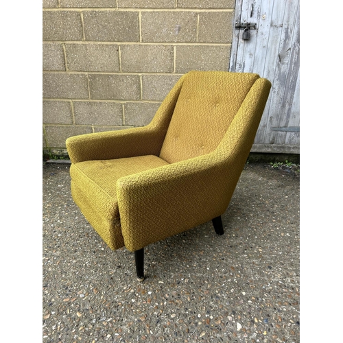 43 - A retro gold upholstered armchair