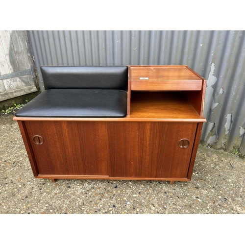 46 - A mid century teak telephone table