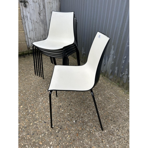 53 - A set of six black  and white plastic stacking chairs MARKED 3D PEDRALL Made in Italy