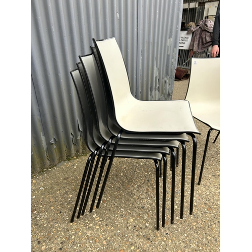 53 - A set of six black  and white plastic stacking chairs MARKED 3D PEDRALL Made in Italy