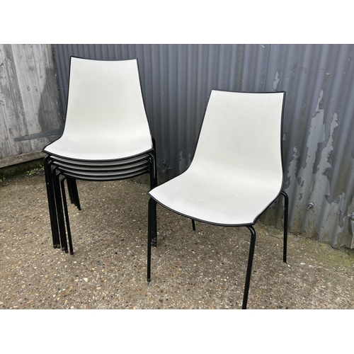 54 - A set of six black  and white plastic stacking chairs MARKED 3D PEDRALL Made in Italy