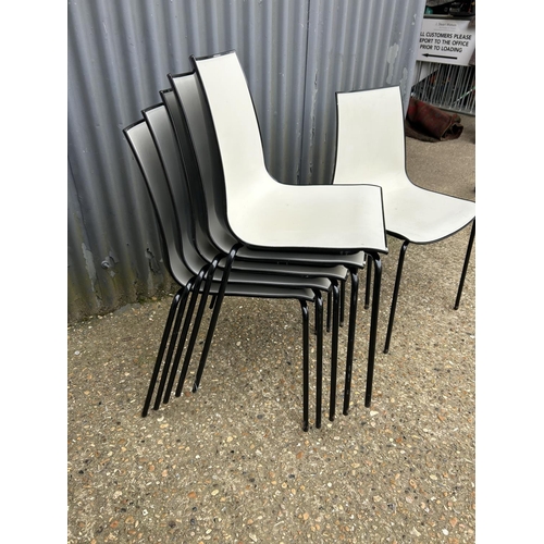 54 - A set of six black  and white plastic stacking chairs MARKED 3D PEDRALL Made in Italy