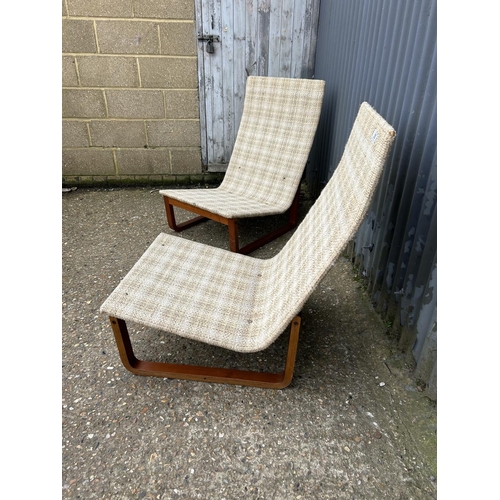 55 - A pair of mid century teak framed lounger chairs with oatmeal upholstery