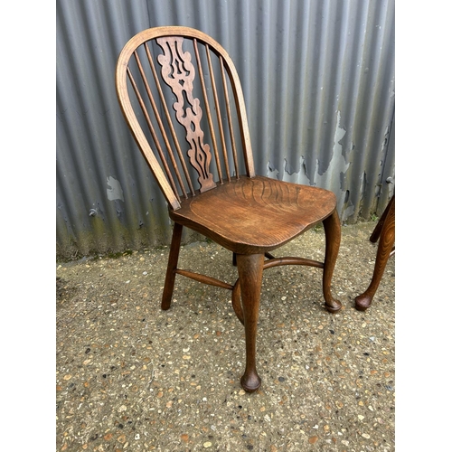 60 - A pair of country chairs with crinoline stretcher