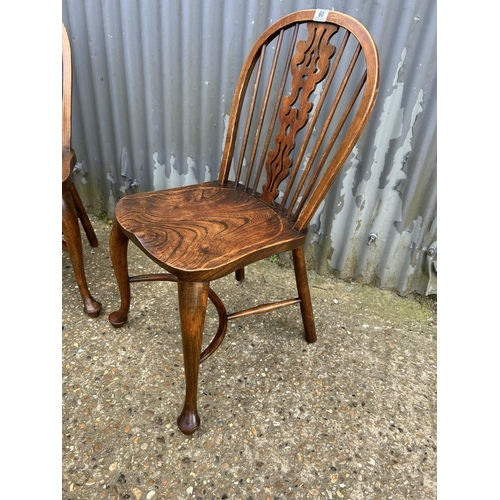 60 - A pair of country chairs with crinoline stretcher