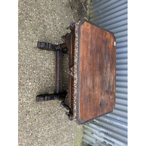 67 - A carved oak centre table with drawer 85x62x77