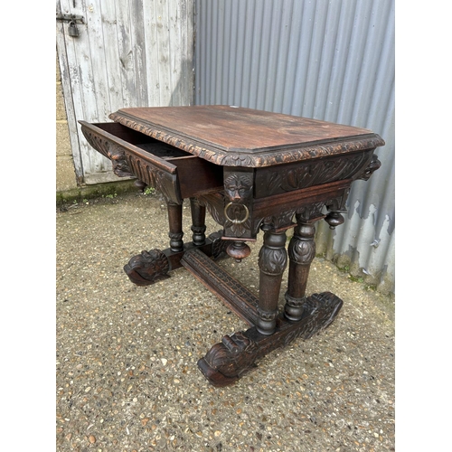 67 - A carved oak centre table with drawer 85x62x77