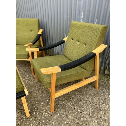 70 - A pair of danish style chairs upholstered in green together with matching stool