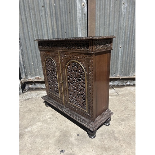 8 - A carved hardwood two door cupboard with drawer  87x30x88