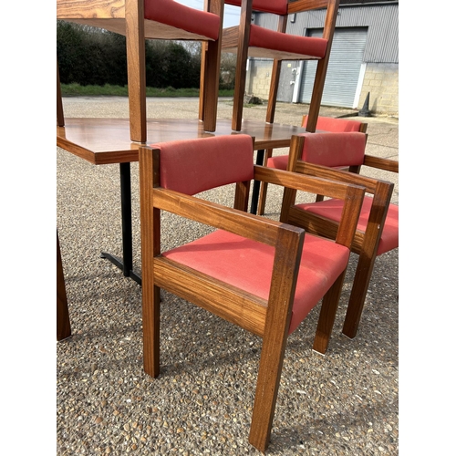 83 - A mid century teak table 76x154 together with a set of Swedish style teak framed carver chairs with ... 