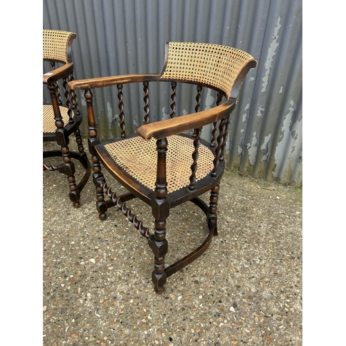 85 - A pair of oak barley twist tub chairs with bergere  seats