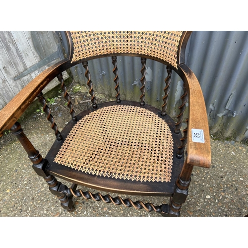 85 - A pair of oak barley twist tub chairs with bergere  seats