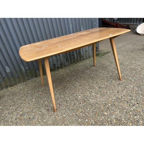 97 - An Ercol plank top dining table