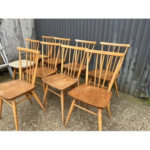 98 - A set of 9 Ercol light light elm stick back chairs (one AF to back spindle)