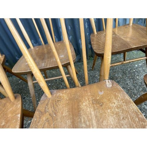 98 - A set of 9 Ercol light light elm stick back chairs (one AF to back spindle)