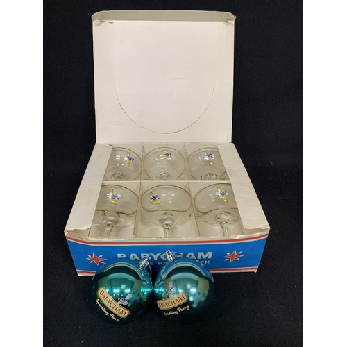 569 - Boxed set of 6 Babycham glasses and 2 Babycham baubles