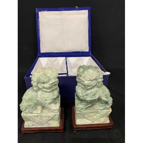 631 - Pair of heavy green Soapstone Dogs of Fo on stands, height 22cms