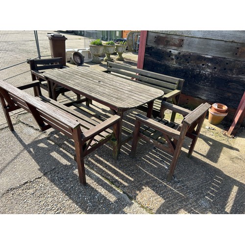 320D - A large wooden garden furniture set consisting of 5ft table, two benches and two chairs