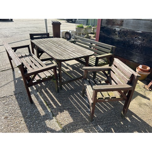 320D - A large wooden garden furniture set consisting of 5ft table, two benches and two chairs