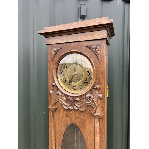 155H - An arts and crafts style oak long case  clock with pendulum and weights