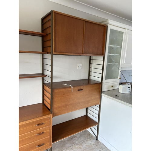 1 - A ladderax three bay home wall cabinet system by STAPLES with cocktail compartment, bureau, shelves,... 