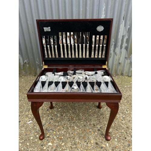 104 - A mahogany cased canteen of silver plated cutlery by COOPER LUDDENHAM