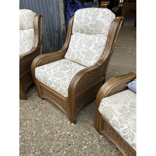 116 - A wicker three piece conservatory suite consisting of a two seater sofa and two chairs