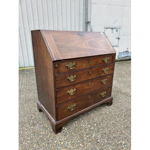 13 - A Georgian mahogany bureau with fitted interior, fall front and four graduated drawers 94cm wide