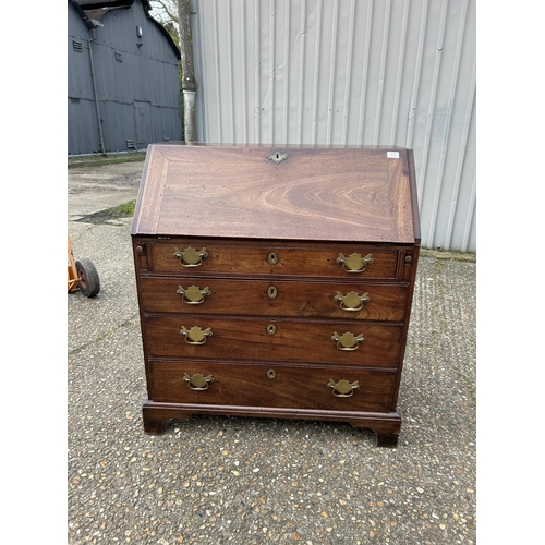 13 - A Georgian mahogany bureau with fitted interior, fall front and four graduated drawers 94cm wide