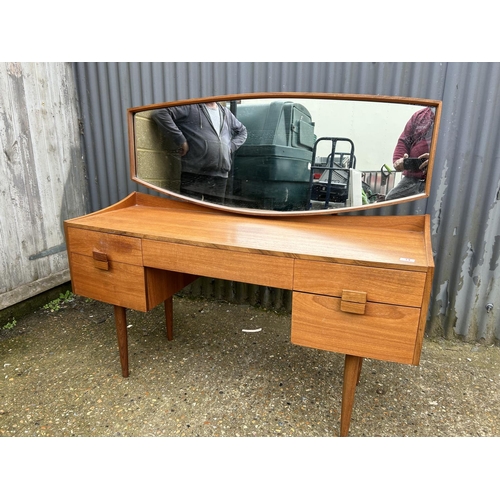 14 - A teak mid century dressing table with mirror