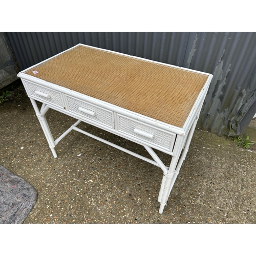 147 - A white painted bamboo three drawer writing table 106x60x83